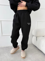 ČIERNE TEPLÁKOVÉ NOHAVICE SELF LOVE