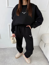 ČIERNE TEPLÁKOVÉ NOHAVICE SELF LOVE