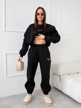 ČIERNE TEPLÁKOVÉ NOHAVICE SELF LOVE